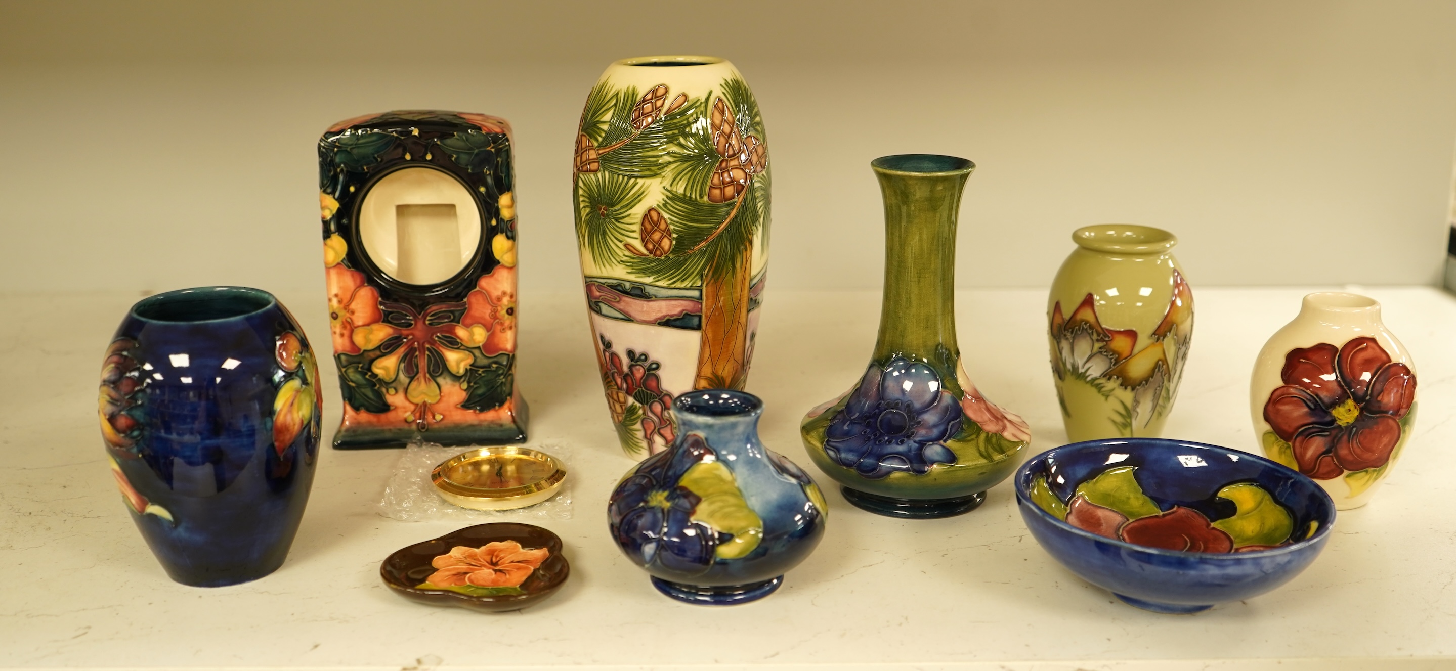 A collection of nine modern Moorcroft pieces including a Furzy Hill vase and a Toadstool vase, tallest 19cm